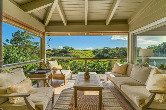a view of a balcony with lake view and a couches