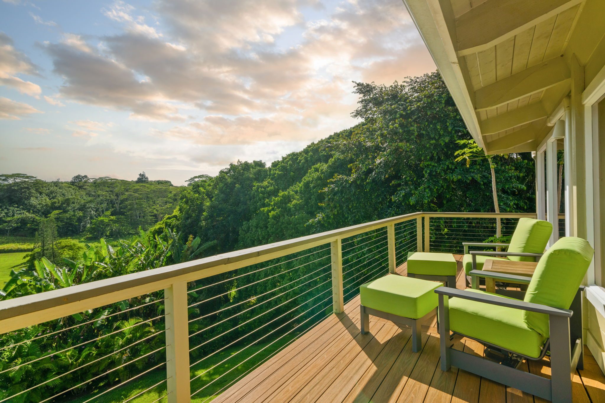 3707 Omao Road Koloa, HI 96756 - Photo 21 of 27 a view of a balcony with wooden floor and outdoor seating