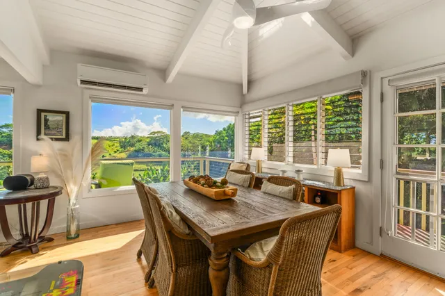 a view of a dining room with furniture window and outside view