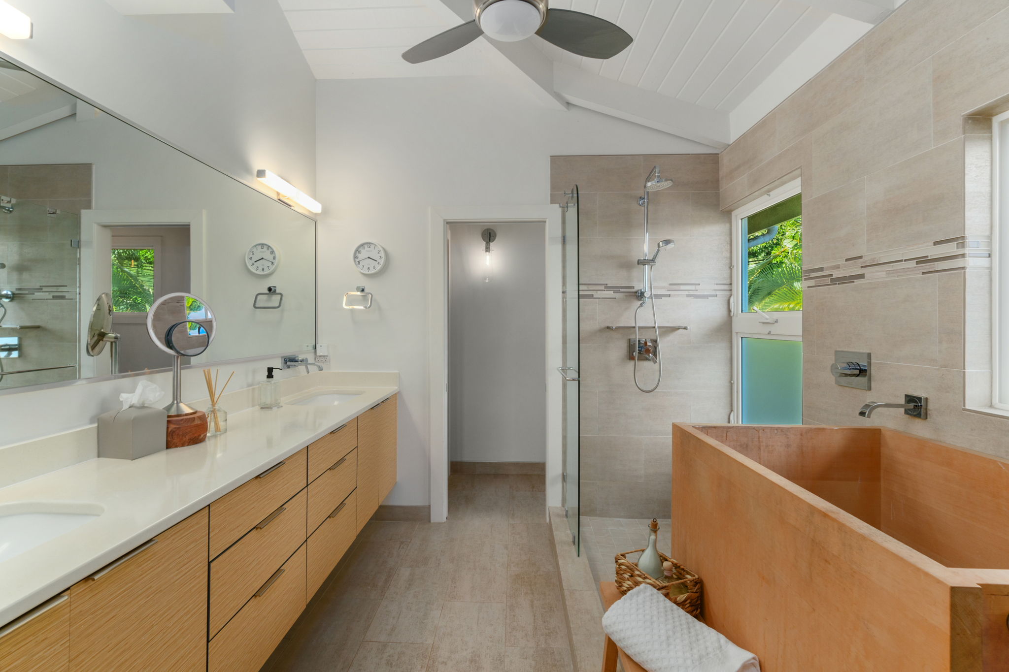 3707 Omao Road Koloa, HI 96756 - Photo 9 of 27 a bathroom with a tub sink and mirror