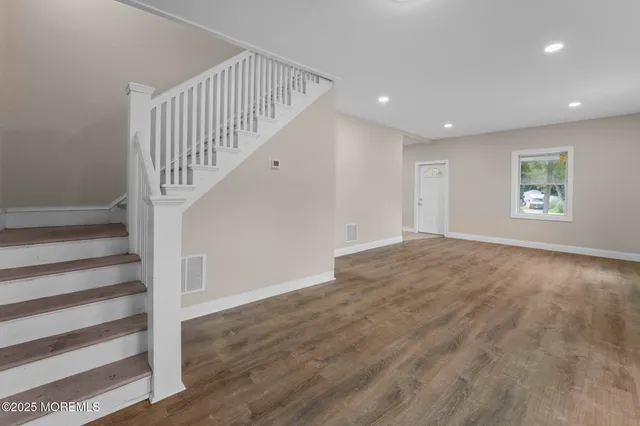 a view of entryway with wooden floor