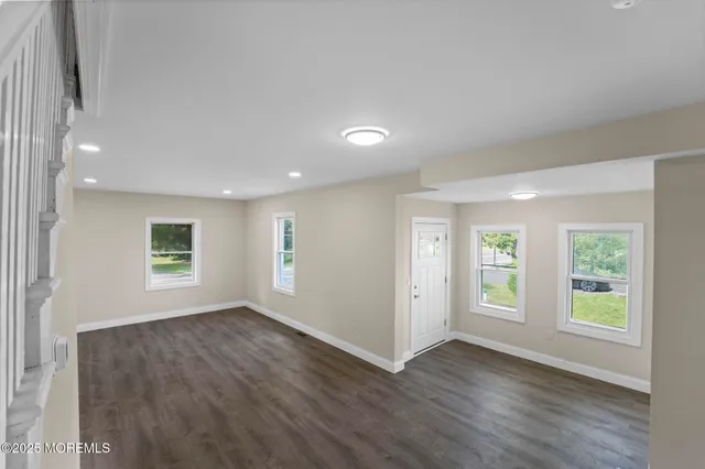 an empty room with wooden floor