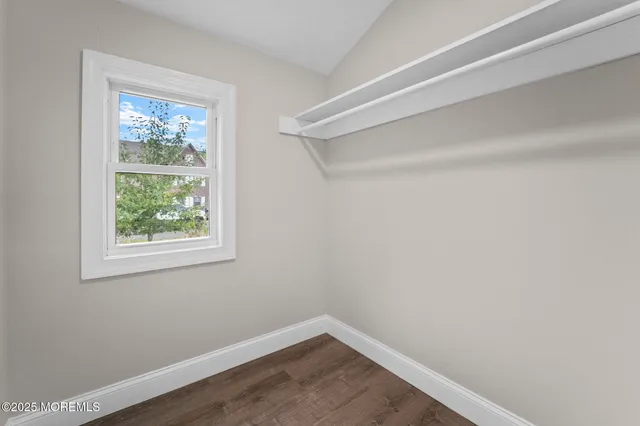 a view of yard with swimming pool and trees in the background