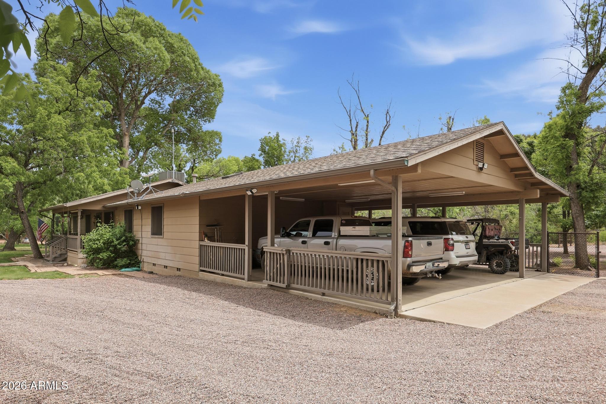 7736 West Gibson Ranch Road Payson, AZ 85541 - Photo 5 of 51 a view of a patio with table and chairs under an umbrella