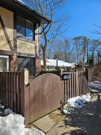 a front view of a house with parking space