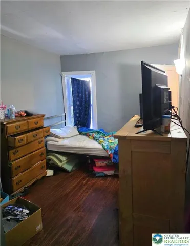 a room with furniture and wooden floor