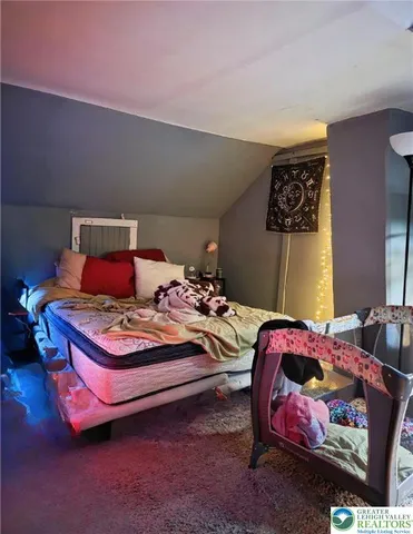 a bedroom with a bed and a table