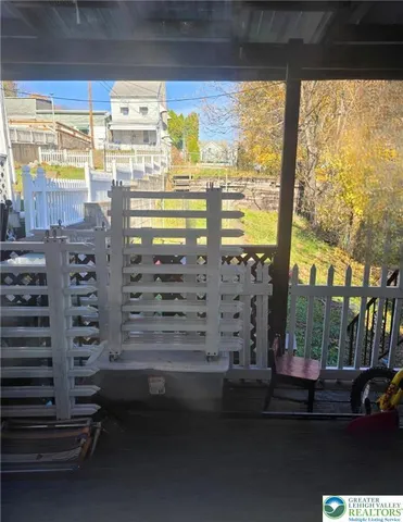 a view of a balcony with chairs