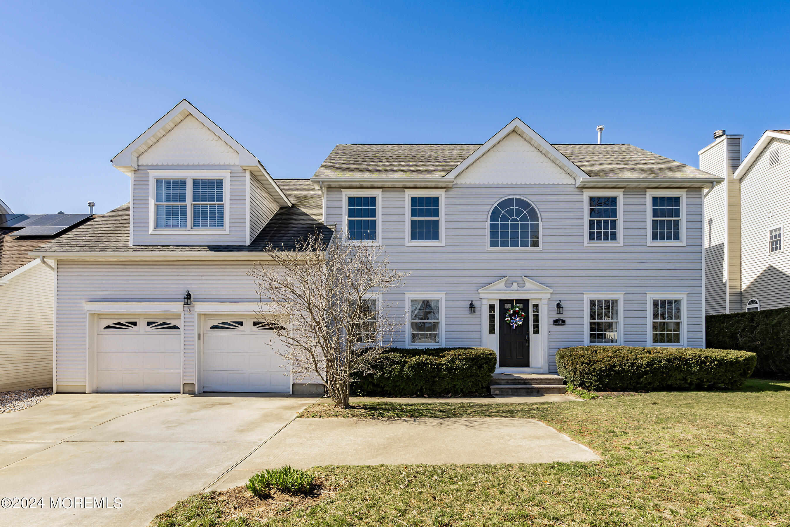 1415 Dorset Dock Road Point Pleasant, NJ 08742 - Photo 1 of 27 a front view of a house with a yard and garage