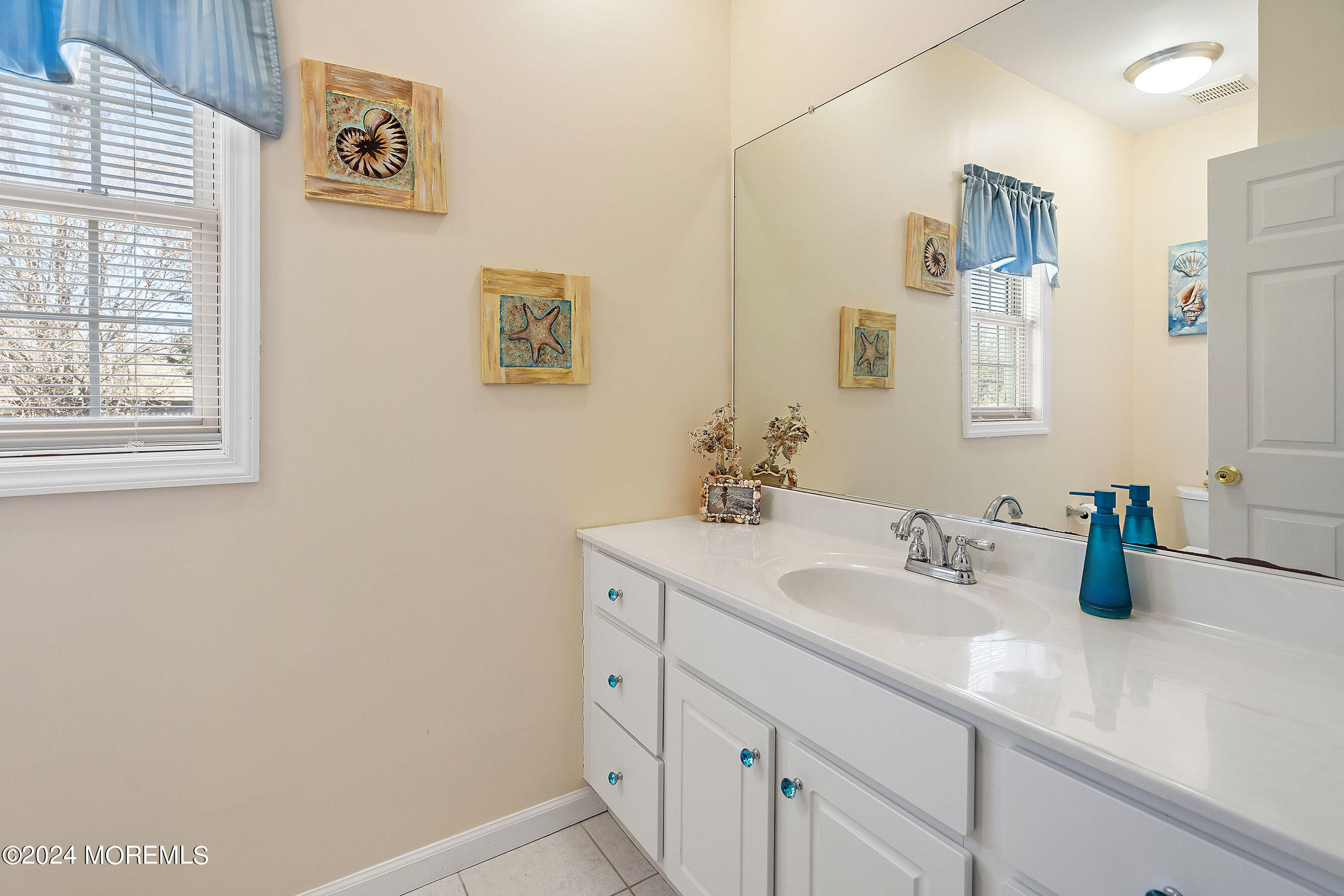 1415 Dorset Dock Road Point Pleasant, NJ 08742 - Photo 11 of 27 a bathroom with a sink and a mirror