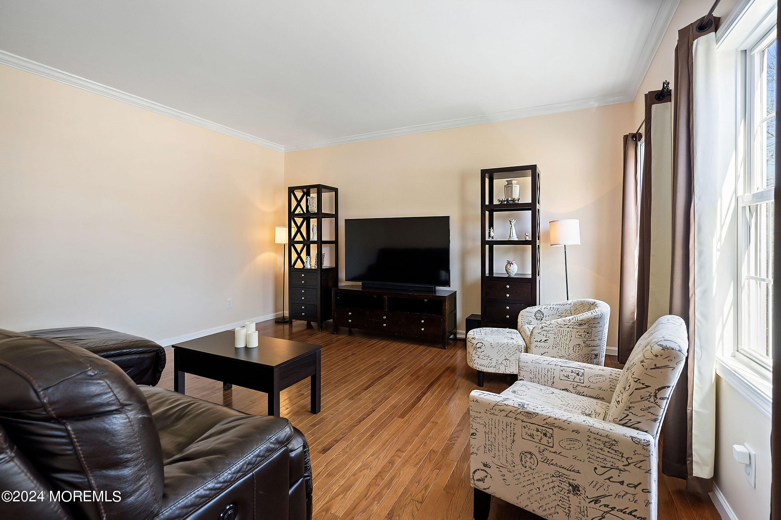 1415 Dorset Dock Road Point Pleasant, NJ 08742 - Photo 4 of 27 a living room with furniture a flat screen tv and a window