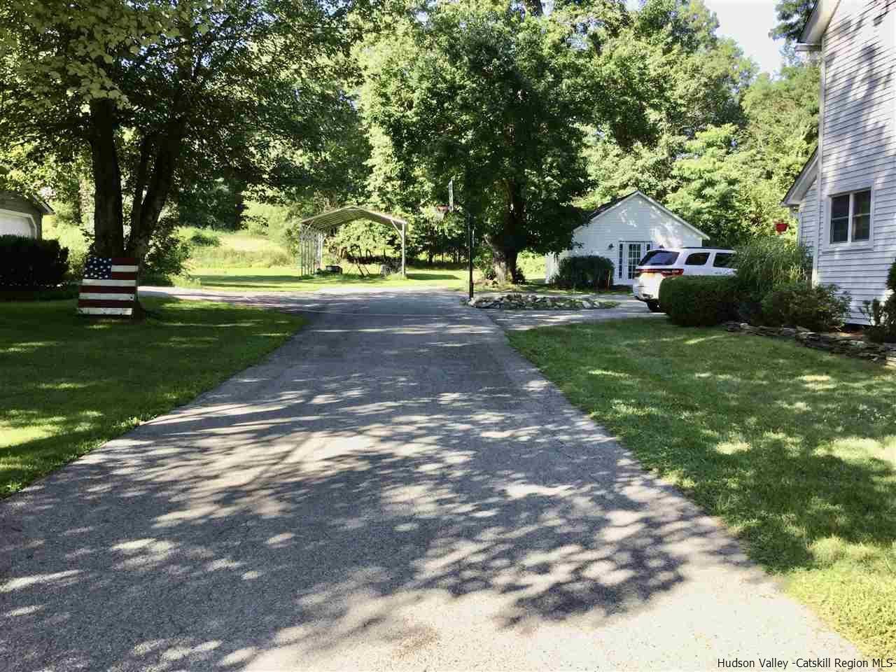 23 Bruyn Turnpike Wallkill, NY 12589 - Photo 16 of 19 a front view of a house with a yard and a tree