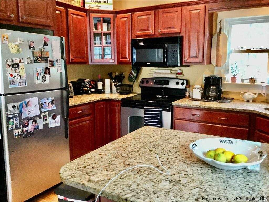 23 Bruyn Turnpike Wallkill, NY 12589 - Photo 9 of 19 a kitchen with stainless steel appliances a stove a sink and a microwave