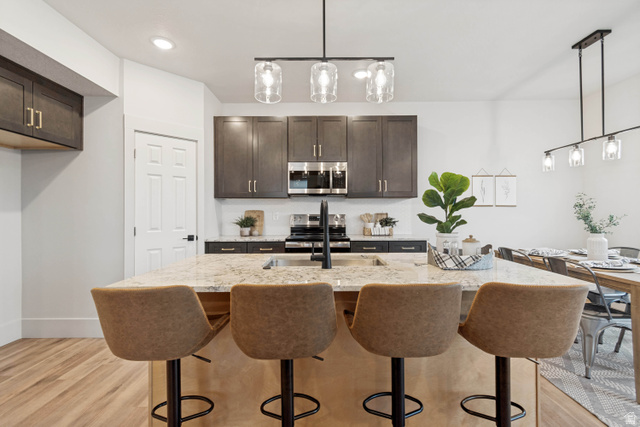 529 North Hvn Drive Mapleton, UT 84664 - Photo 10 of 30 Kitchen island with a light-toned countertop and integrated sink