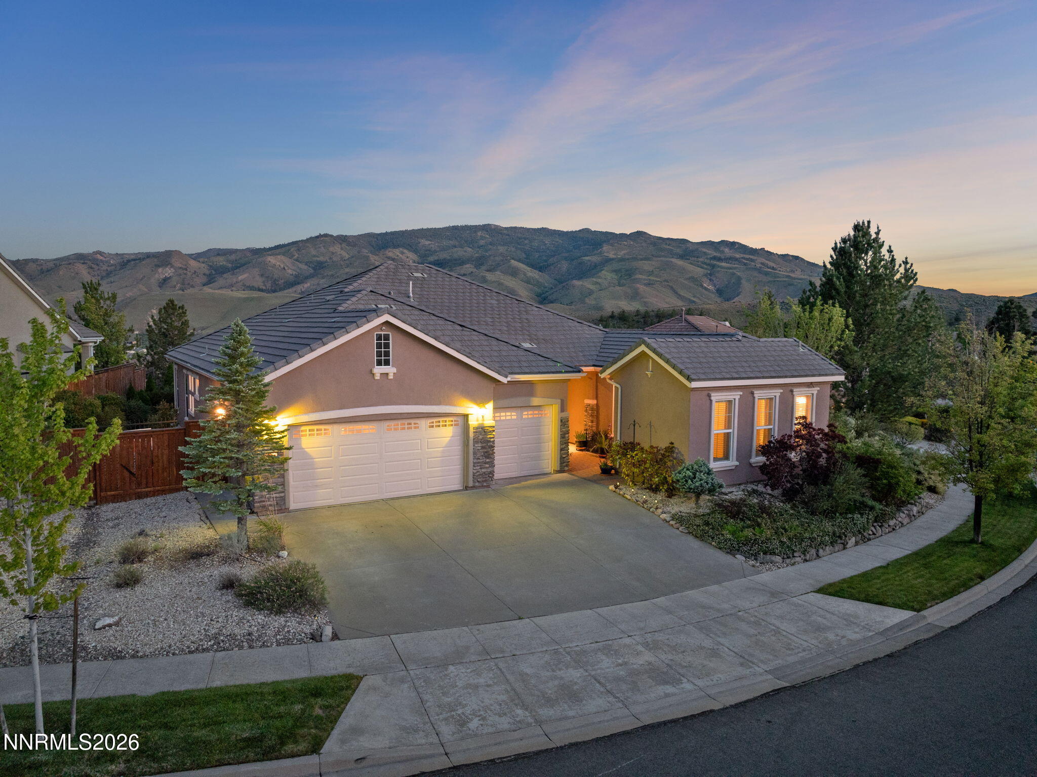 9160 Quilberry Way Reno, NV 89523 - Photo 11 of 53 a front view of a house with a yard and garage