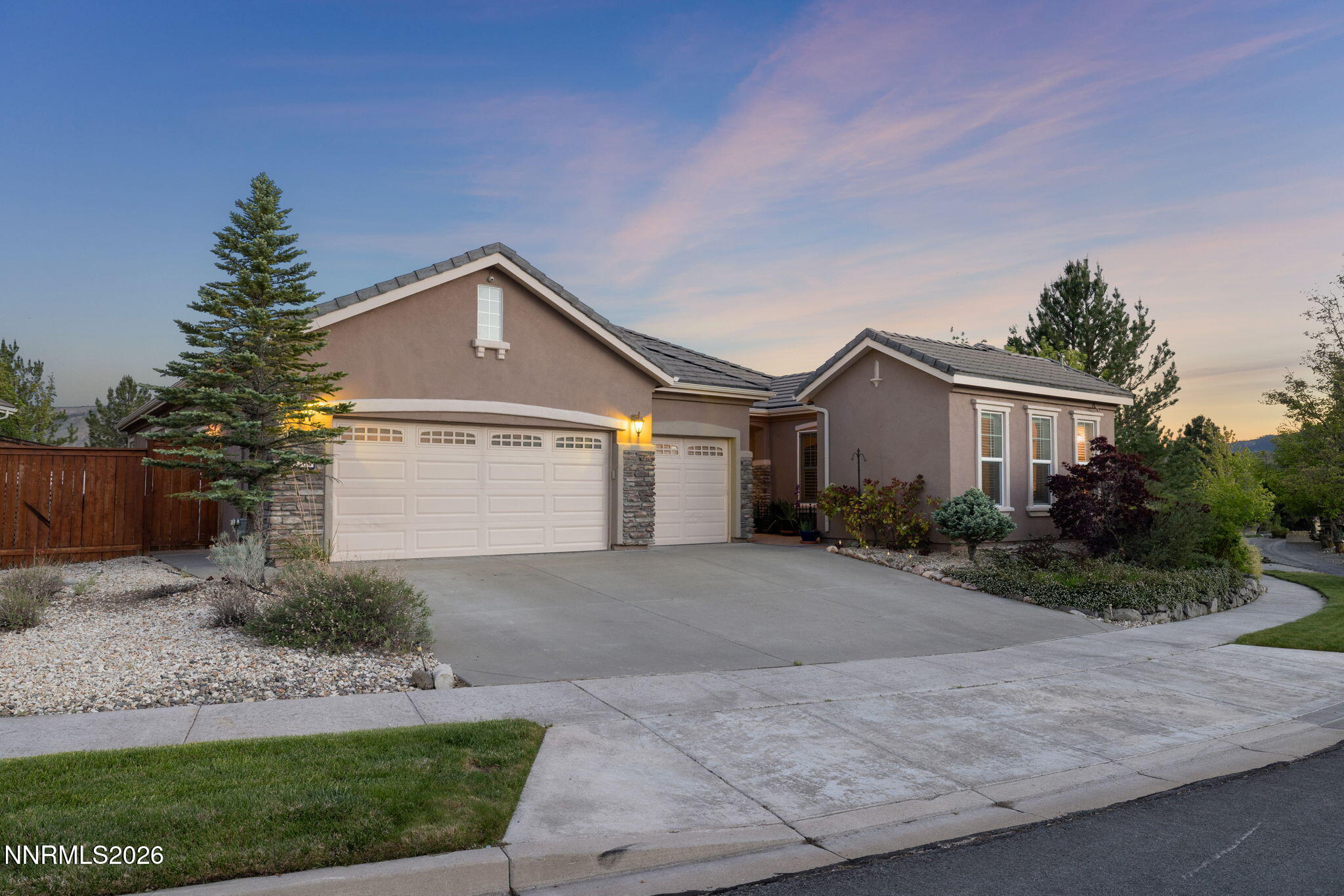 9160 Quilberry Way Reno, NV 89523 - Photo 17 of 53 a front view of a house with a yard and garage