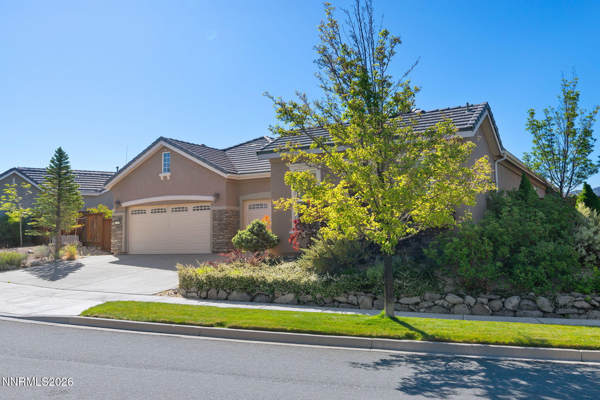 9160 Quilberry Way Reno, NV 89523 - Photo 19 of 53 a view of a house with a swimming pool and a yard