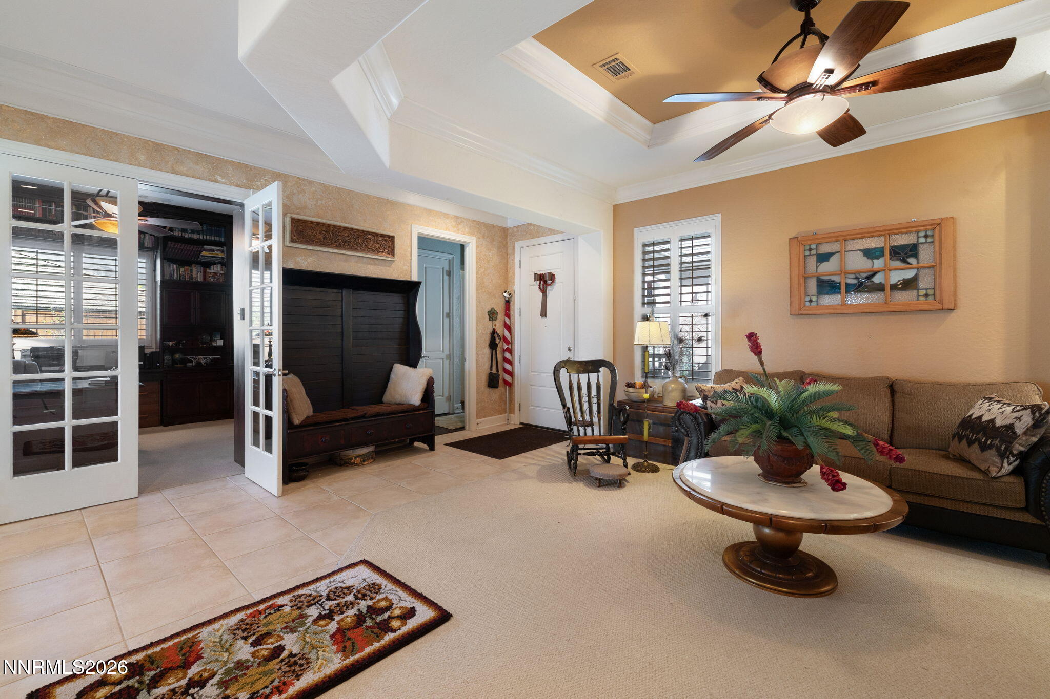 9160 Quilberry Way Reno, NV 89523 - Photo 21 of 53 a living room with furniture a window and a ceiling fan