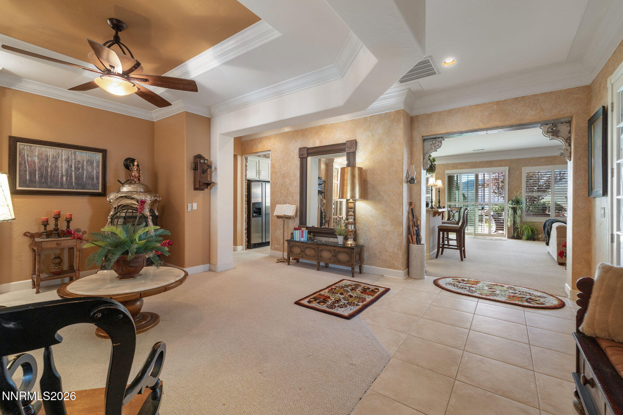 9160 Quilberry Way Reno, NV 89523 - Photo 23 of 53 a living room with furniture a chandelier and a dining table