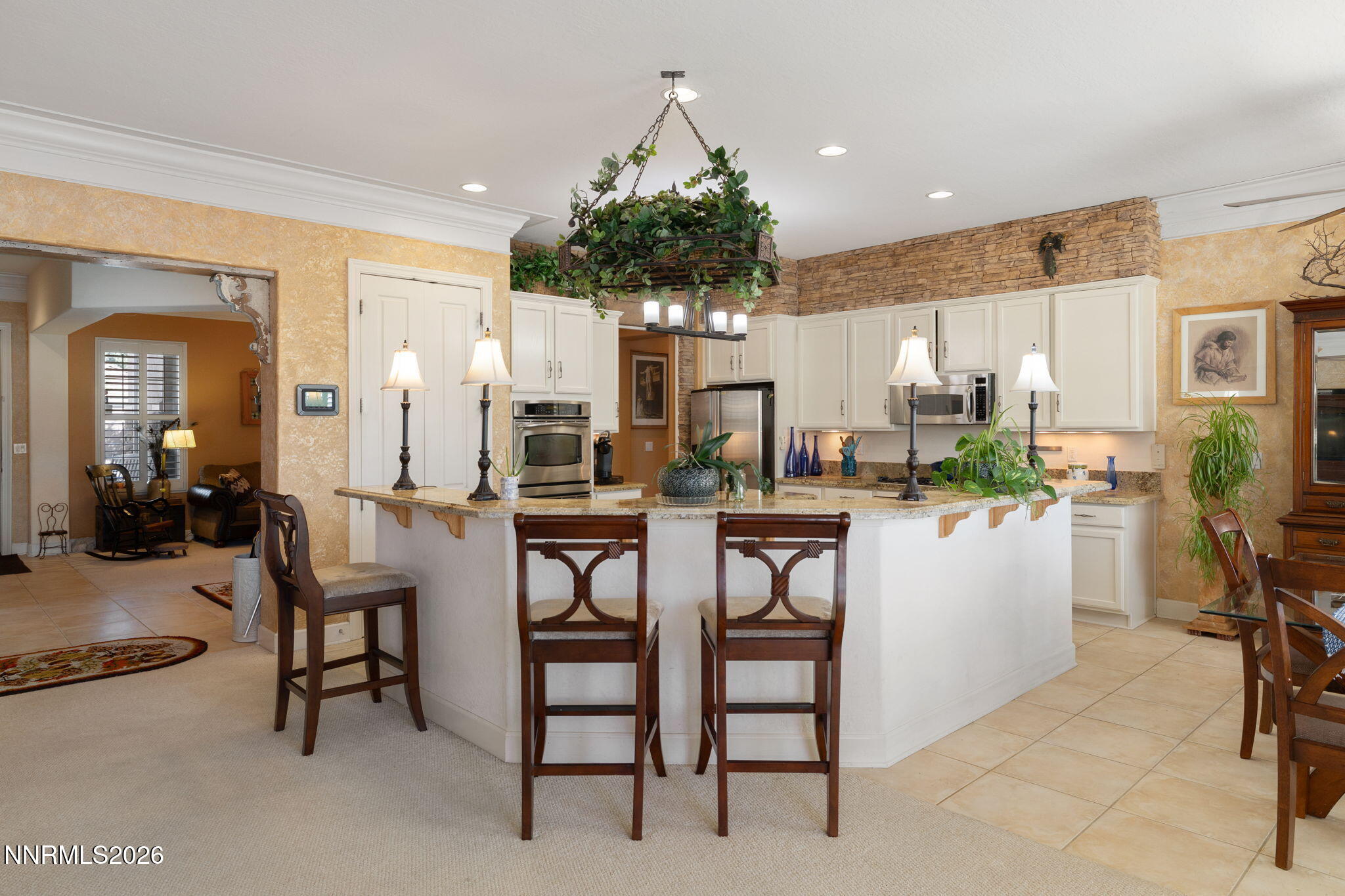 9160 Quilberry Way Reno, NV 89523 - Photo 27 of 53 a kitchen with a table and chairs in it