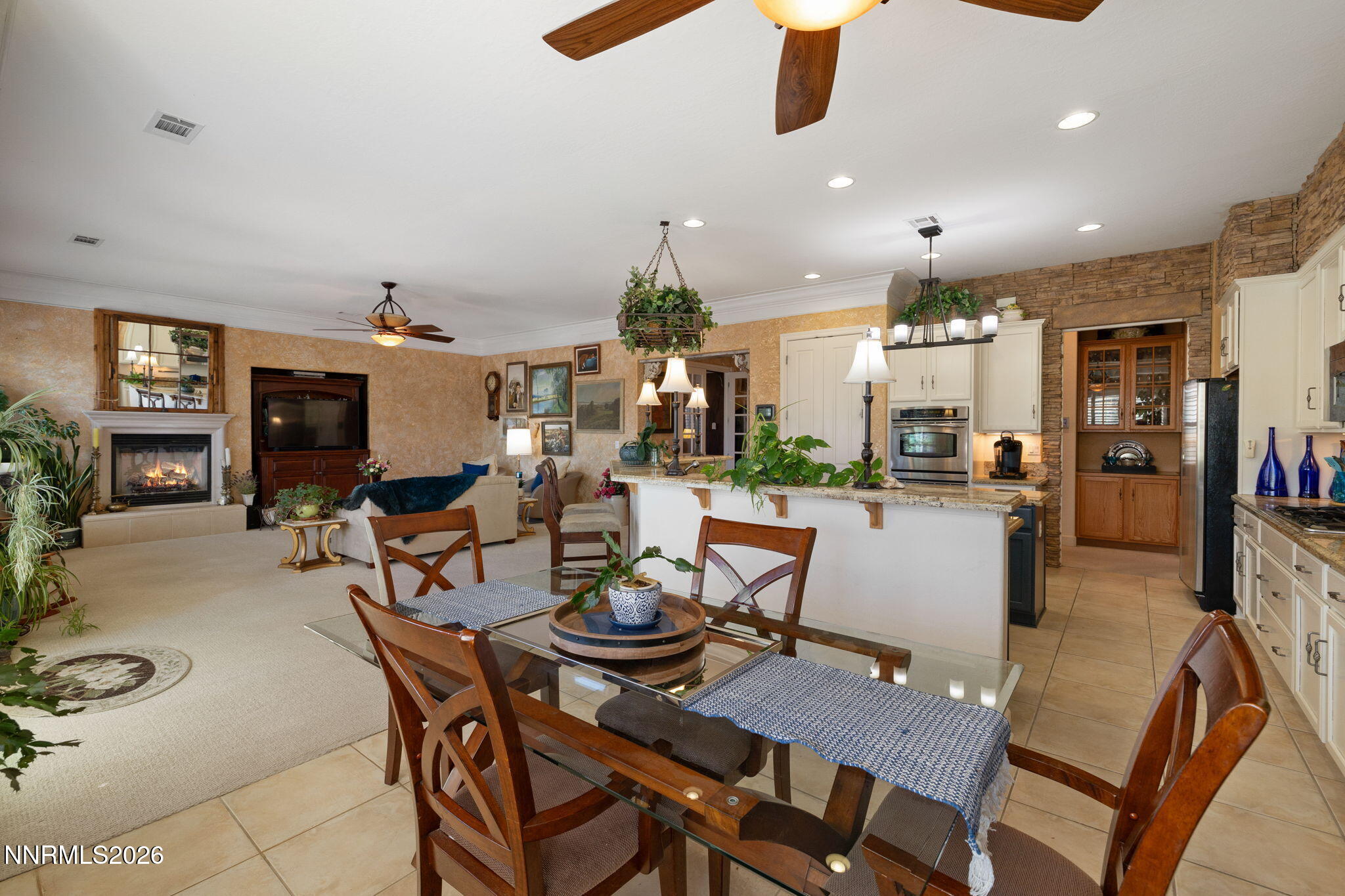9160 Quilberry Way Reno, NV 89523 - Photo 28 of 53 a living room with furniture kitchen view and a chandelier