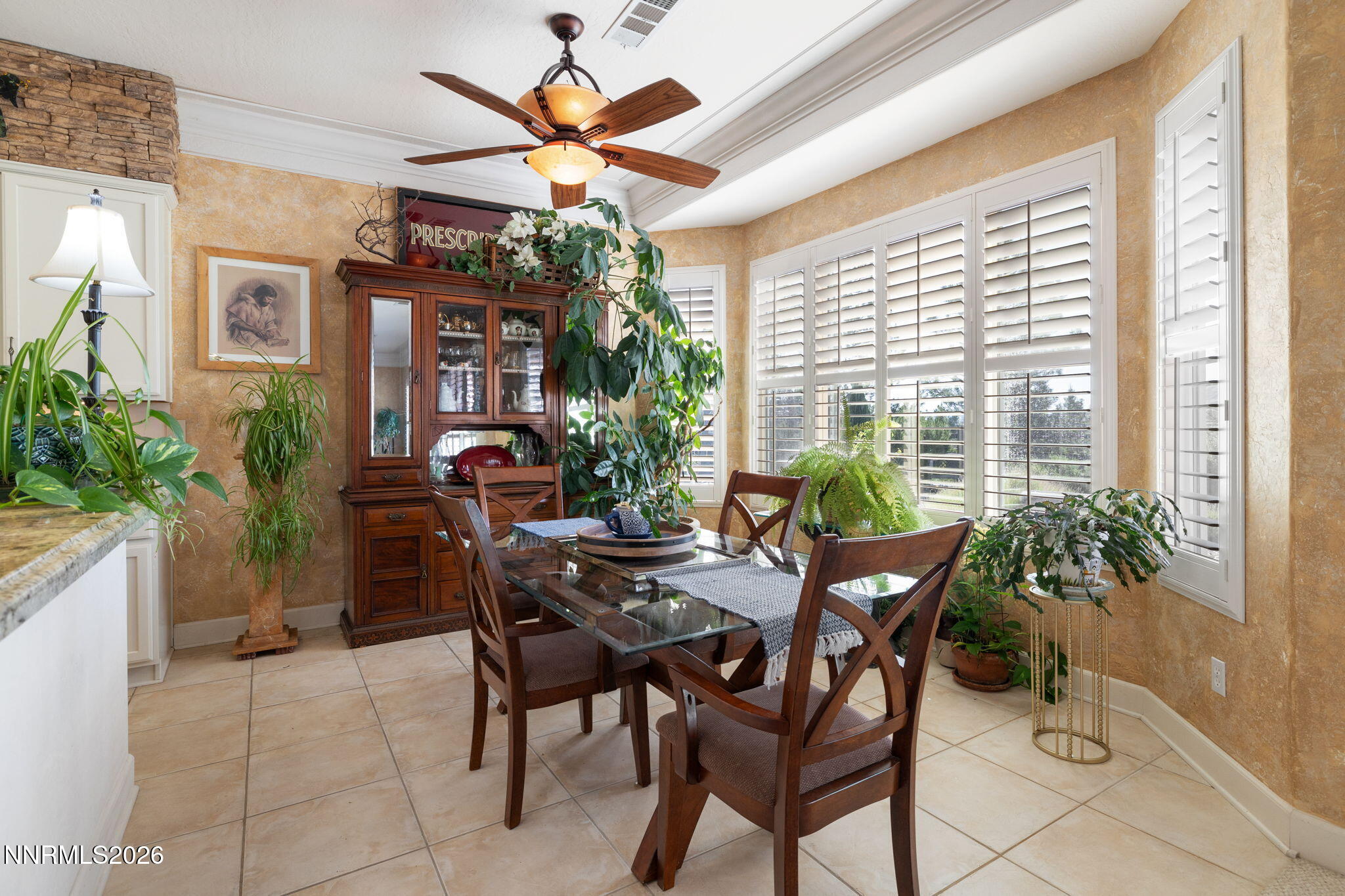 9160 Quilberry Way Reno, NV 89523 - Photo 29 of 53 a view of a dining room with furniture and a potted plant