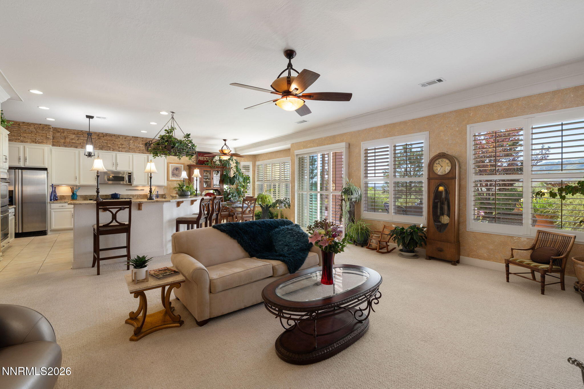 9160 Quilberry Way Reno, NV 89523 - Photo 32 of 53 a living room with furniture ceiling fan and a large window