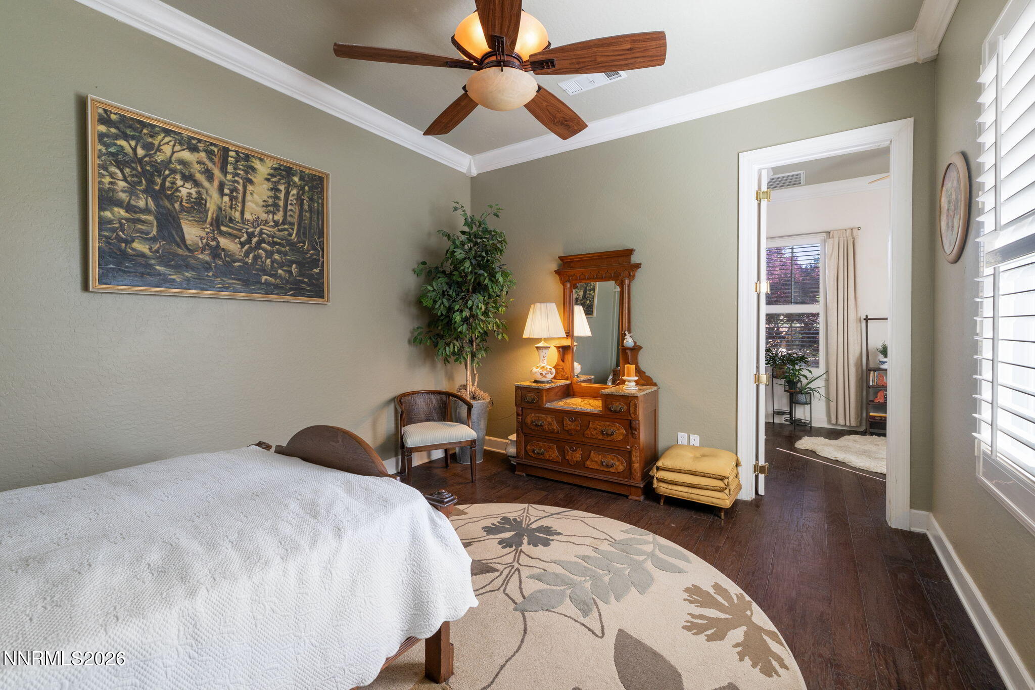 9160 Quilberry Way Reno, NV 89523 - Photo 37 of 53 a bedroom with bed and wooden floor