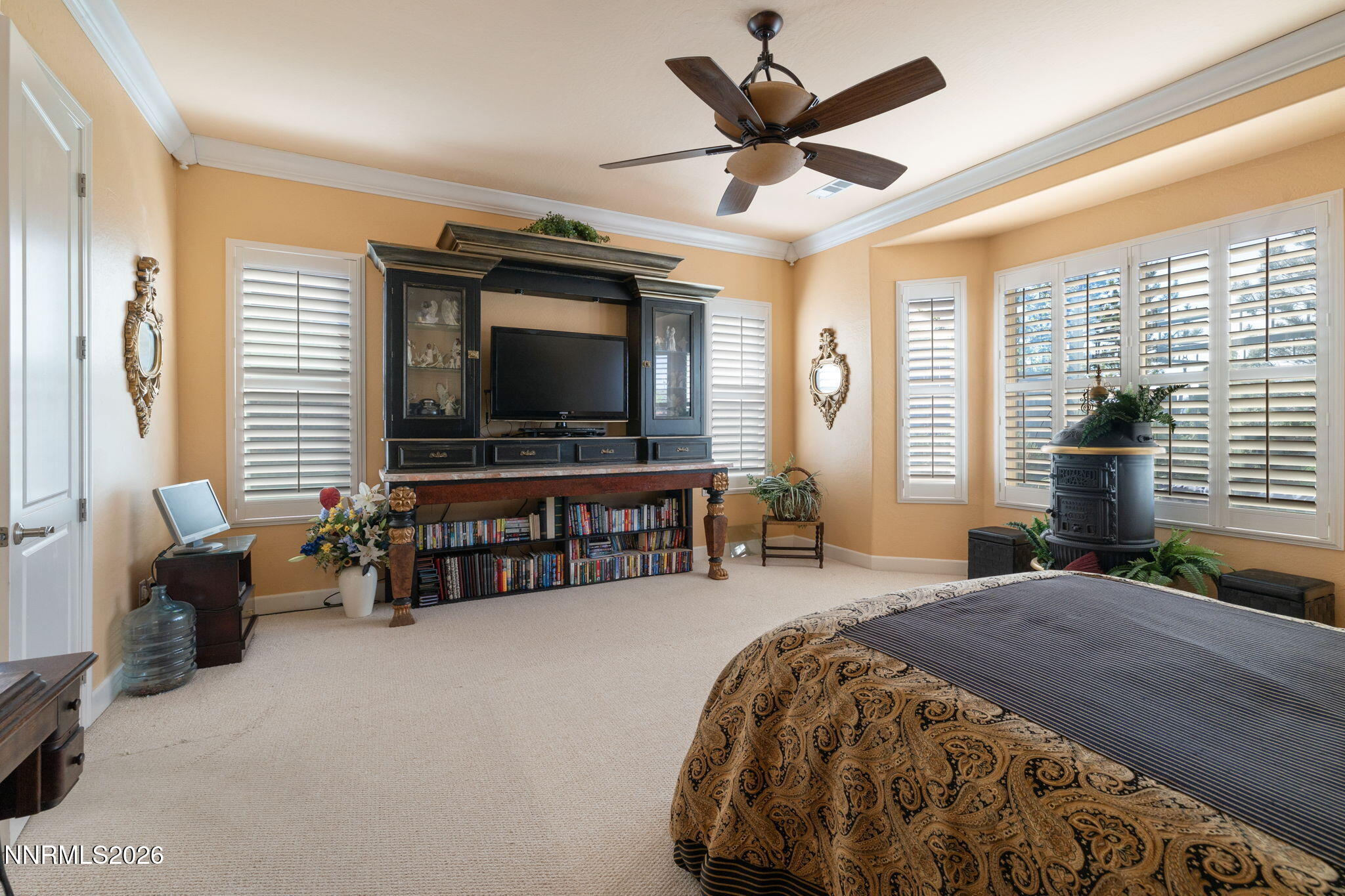 9160 Quilberry Way Reno, NV 89523 - Photo 44 of 53 a spacious bedroom with a bed and a flat screen television