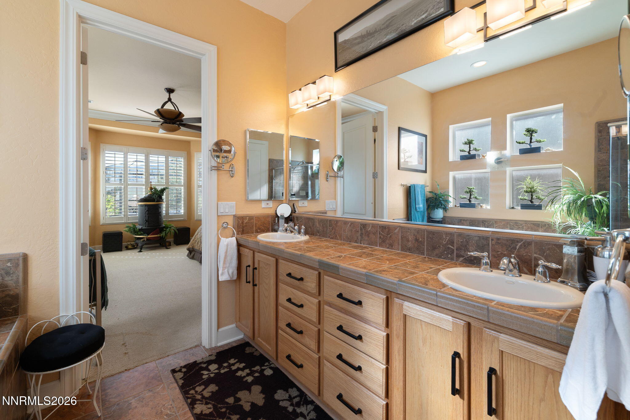 9160 Quilberry Way Reno, NV 89523 - Photo 46 of 53 a spacious bathroom with a granite countertop sink and a mirror