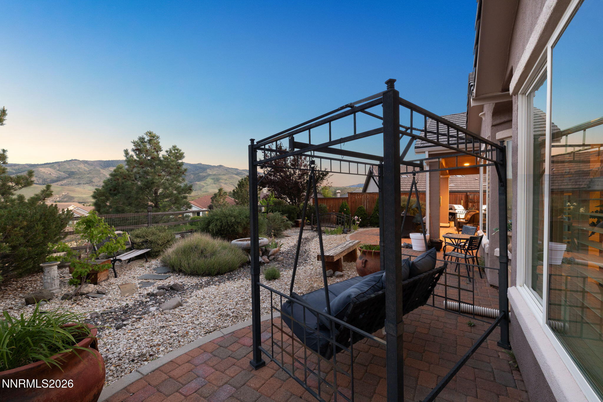 9160 Quilberry Way Reno, NV 89523 - Photo 7 of 53 a view of a balcony with chairs and a potted plant