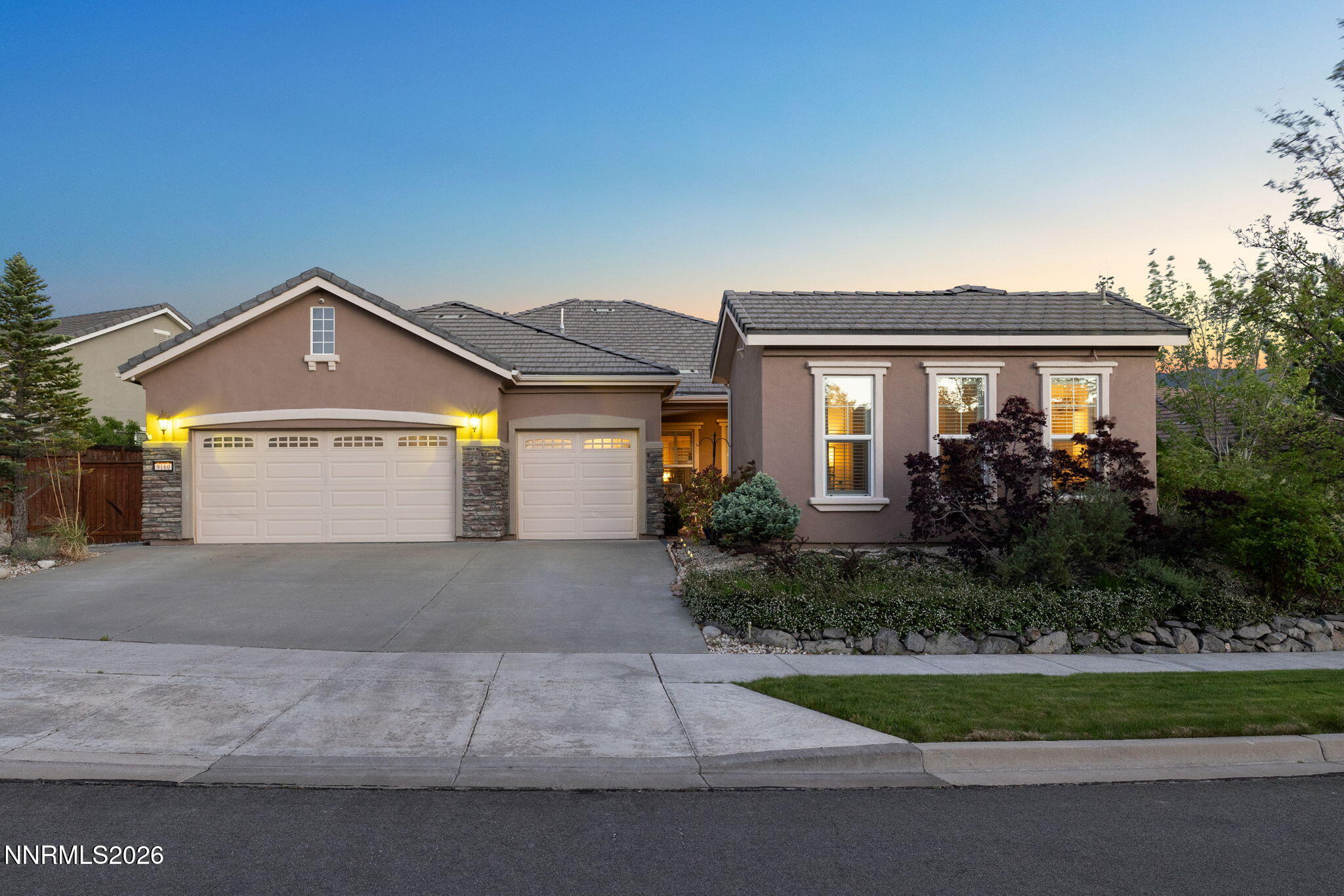 9160 Quilberry Way Reno, NV 89523 - Photo 9 of 53 a front view of a house with a yard and garage