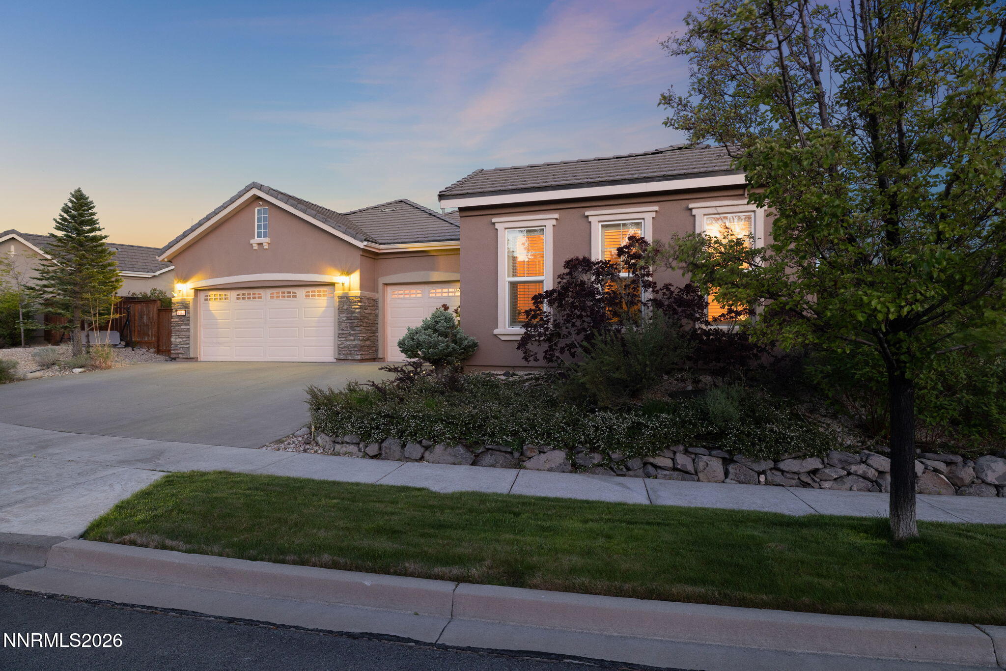 9160 Quilberry Way Reno, NV 89523 - Photo 10 of 53 a front view of a house with a garden