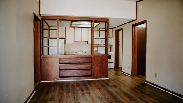 a view of front door with wooden floor