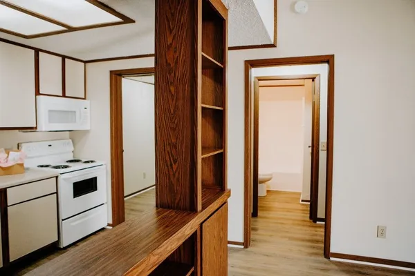 a kitchen with a stove a sink and a refrigerator