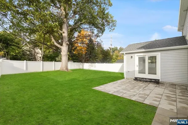 a view of a backyard with a small cabin