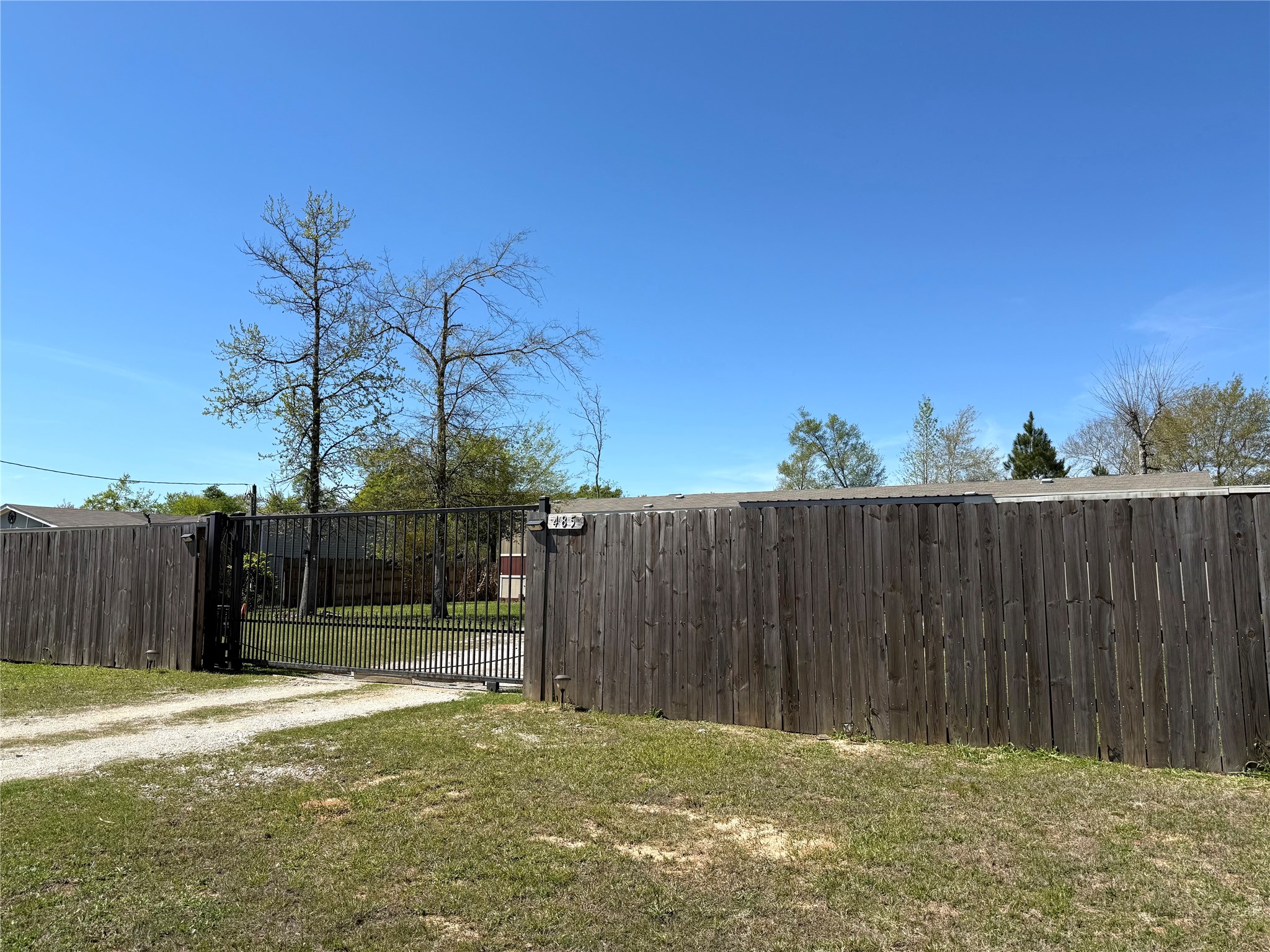 485 County Road 377 Cleveland, TX 77327 - Photo 2 of 16 a backyard of a house