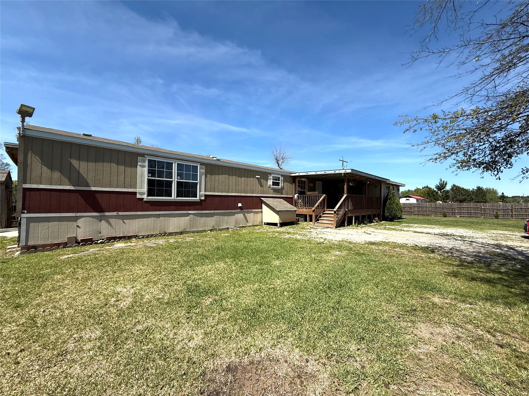 485 County Road 377 Cleveland, TX 77327 - Photo 5 of 16 a front view of a house with garden