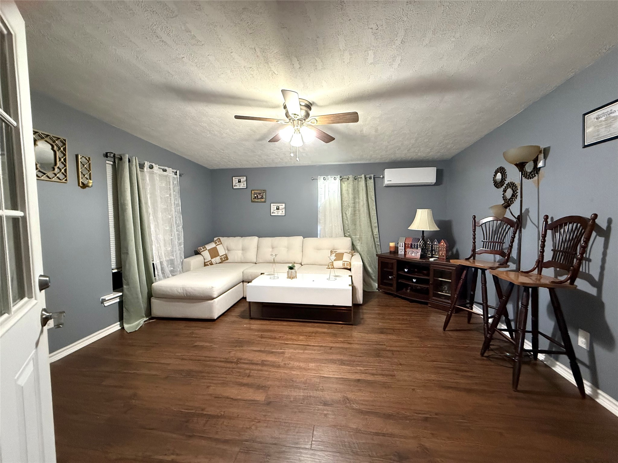 485 County Road 377 Cleveland, TX 77327 - Photo 9 of 16 a living room with furniture and wooden floor