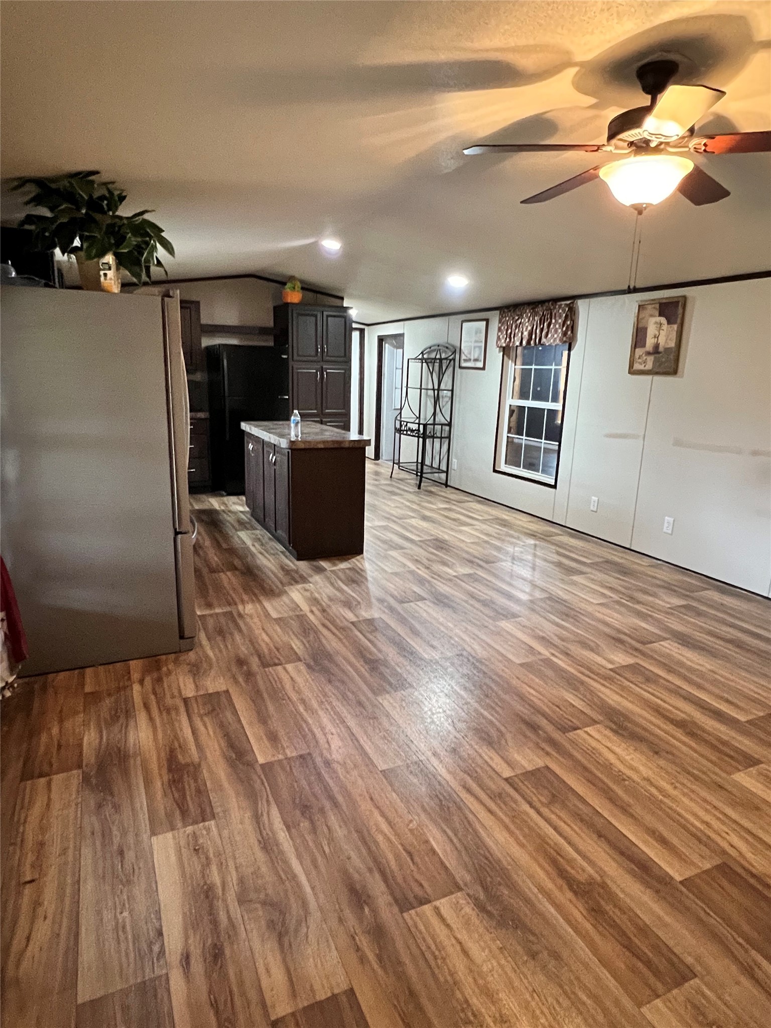 485 County Road 377 Cleveland, TX 77327 - Photo 10 of 16 a view of a room with wooden floor