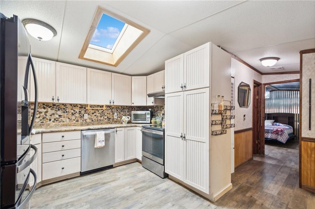 5725 Lockvale Road Rossiter, PA 15772 - Photo 11 of 44 a kitchen with white cabinets and refrigerator