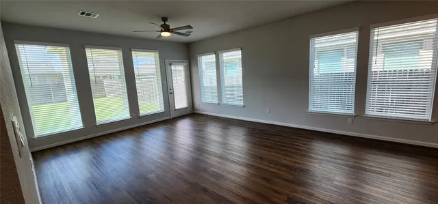 a kitchen with stainless steel appliances granite countertop white cabinets and a stove