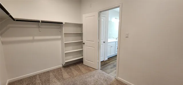 a view of an empty walk in closet