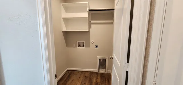 a view of hallway with wooden floor