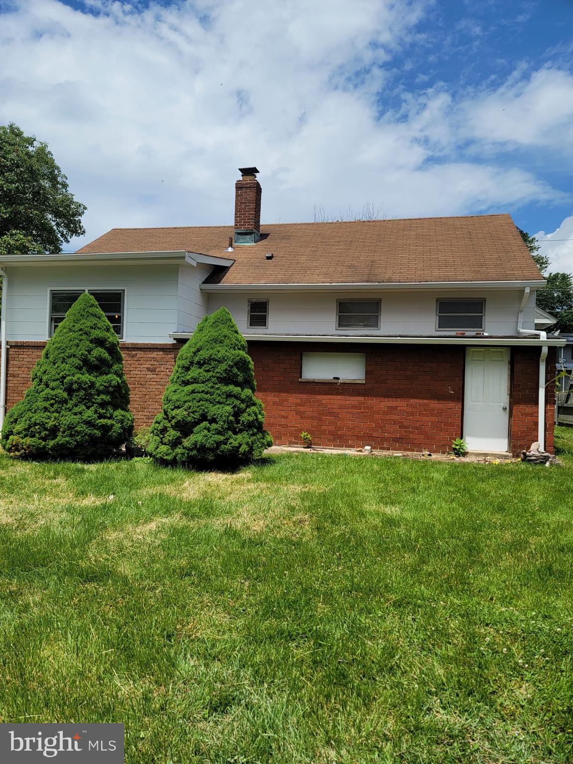 4516 Bennion Road Silver Spring, MD 20906 - Photo 22 of 24 a front view of a house with a garden