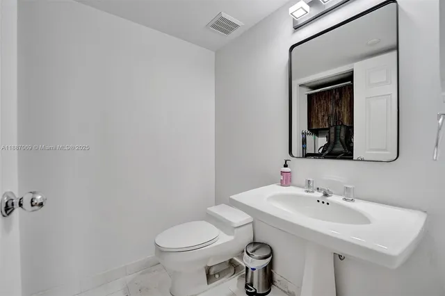 a stove top oven sitting inside of a kitchen