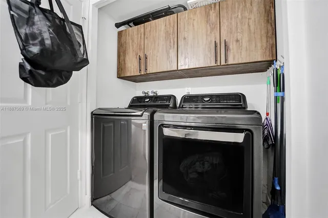 a view of a bathroom with a sink and a mirror