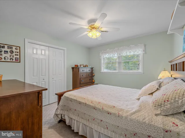a view of a room with furniture and a window