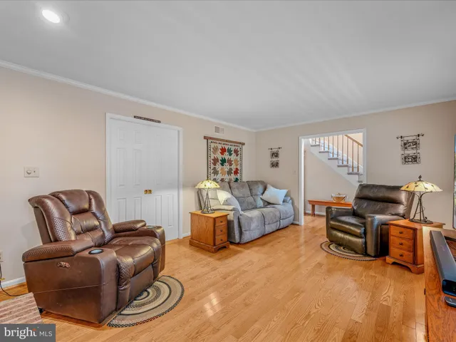 a kitchen with a table chairs sink and cabinets