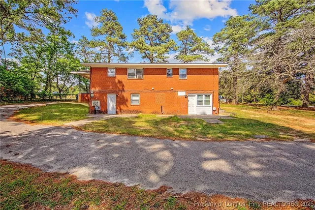 a view of a yard with a tree